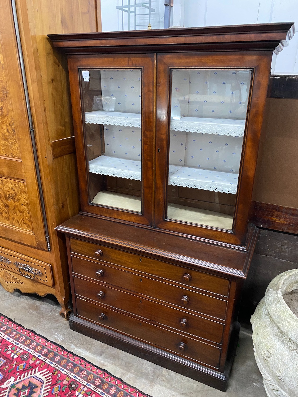 A Victorian mahogany chest with bookcase top, width 105cm, depth 49cm, height 173cm